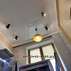 Фото ремонта кухни с светлыми фасадами и темной столешницей